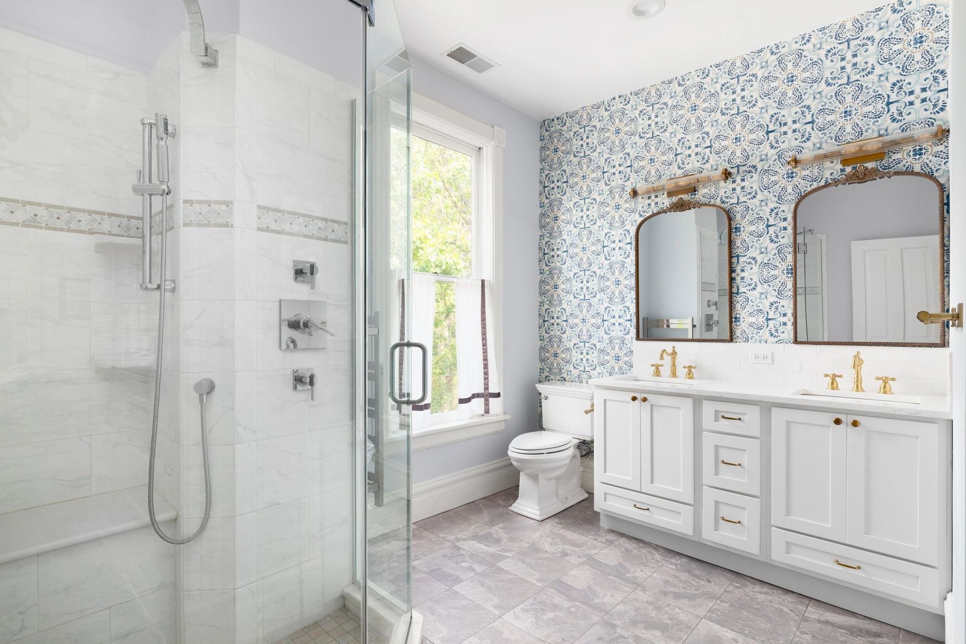 Remodeled bathroom with glass walk-in shower and double vanity in CT